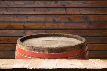 Naklejka premium background of barrel and worn old table of wood. High quality photo
