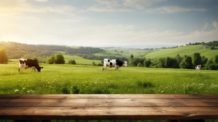 Crédence de cuisine en verre imprimé Prairie, marais Empty wooden table top with grass field and cows in background.