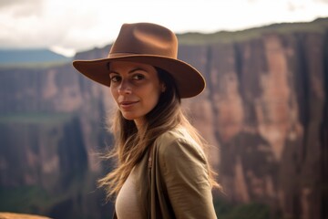 Lifestyle portrait photography of a glad girl in her 30s wearing a classic fedora at the mount roraima in guiana shield south america. With generative AI technology