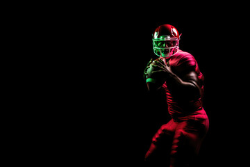 American Football Player in Neon Lighting Holding Leather Ball with Copy Space: Concept for Competitive Sports, Dramatic Action, and Professional Athletes - Generative AI - 641795166