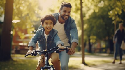 Father teaching his son cycling at park