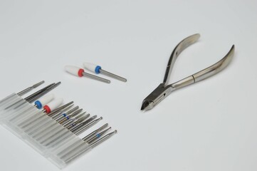 A set of manicure tools on a white background - cuticle nippers and cutters. Tools for hardware...