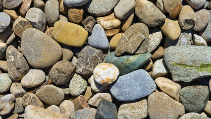 pebbles on the beach for the background in 16x9 format