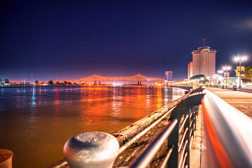 Night view of the Missisippi river with Crescent City Connection Bridge New Orleans Louisiana 