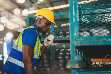 Confident African American Industrial Factory Workers Collaborating in Warehouse for Efficient Distribution. Collaborative Manufacturing and Logistic Success