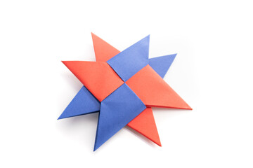 Paper ninja star on a white background. origami star. paper crafts