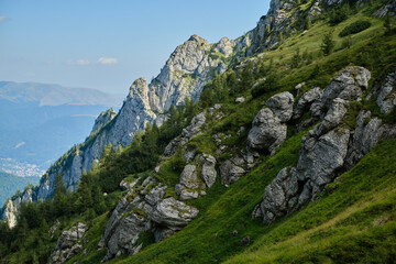 Beautiful mountain terrain in Bucegi National Park  Mountain landscape with green meadow and sharp rocks.