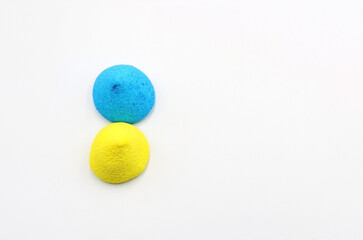 Two sugar jelly beans with the colors of the flag of Ukraine