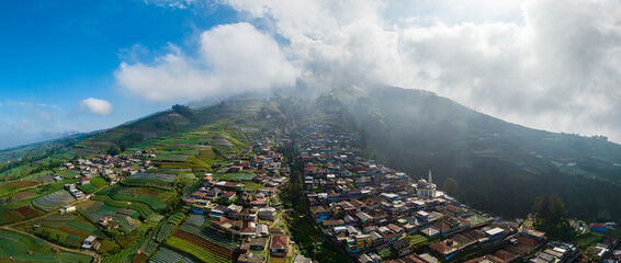 Aerial View panorama of colorful stack building houses in Nepal van Java village and Mount Sumbing,...