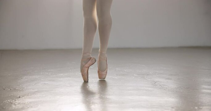 Woman, ballet and dancer spinning around in studio on point feet for creative dancing performance. Talent, person and artist at academy or theatre for fitness training, workout and competition