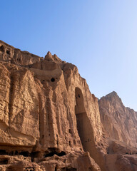 Buddhas of Bamiyan, where there were two 6th-century monumental statues carved into the side of a cliff, in the Bamyan valley of central Afghanistan. Now only holes remain.