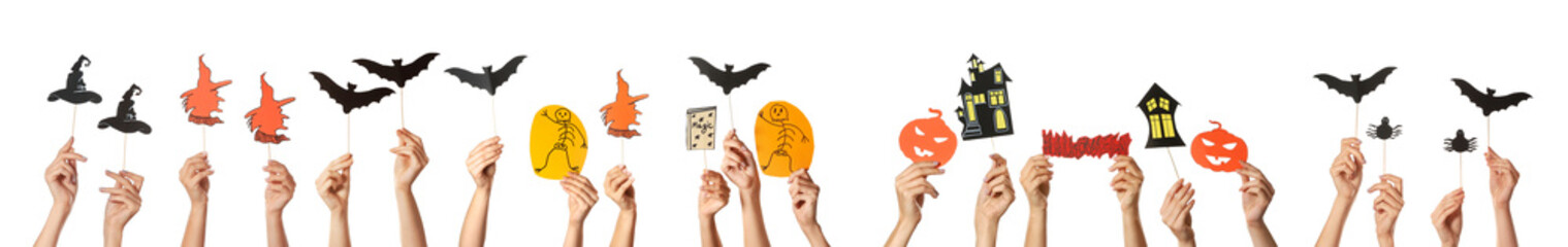 Many hands with Halloween decor on white background