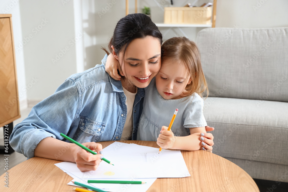 Sticker young woman with her little daughter drawing at home