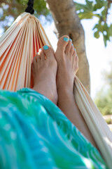 woman relaxing in hammock, beach holidays