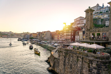 Beautiful colorful building facede in Porto Portugal next to Duero river in Ribeira in sunset