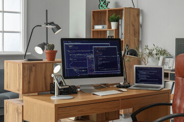 Programmer's workplace with computer in office