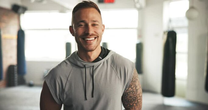 Happy, face and man at the gym for fitness, workout or training in the morning. Smile, sports and portrait of young strong athlete or person at a club for cardio, exercise or wellness while laughing