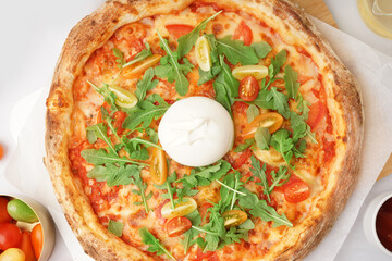 Tasty pizza with Burrata cheese on white background