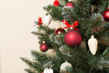 Christmas tree with red decor, closeup view