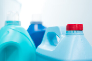 Some blue liquid soap bottles on blue background
