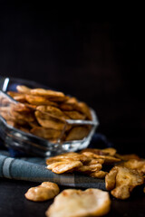 Some toast avas from glass pot on black background