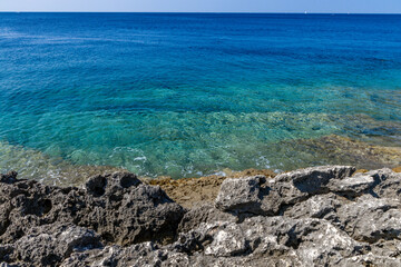 Fototapeta na wymiar Pebble beach vacation on the Adriatic Sea in Pula Istria Kamenjak