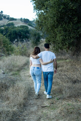 couple walking in the woods