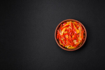 Delicious fresh saute sweet bell pepper slices with onion, salt, spices and herbs