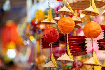 Decorated colorful lanterns hanging on a stand in the streets in Ho Chi Minh City, Vietnam during...