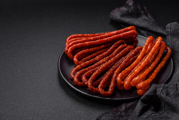 Delicious thin smoked hunting sausages with salt, spices and herbs