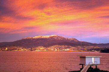 Mount Wellington with snow and the city of Hobart from across the Derwent River - 641855764