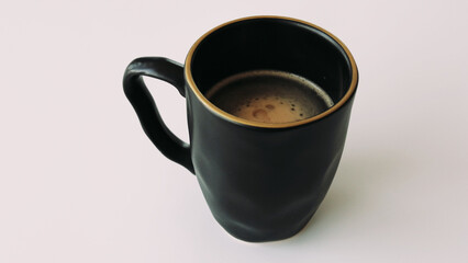 Videoa cup of hot coffee with rising steam on a black background