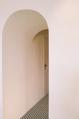 Door in the arch in the neutral color interior