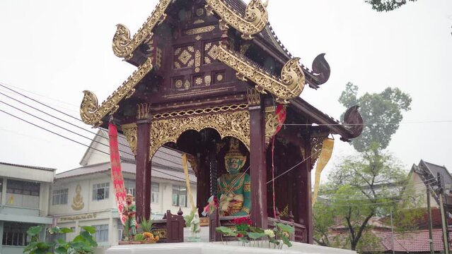 Wat Chedi Luang Worawihan temple statue in Chiang mai while raining