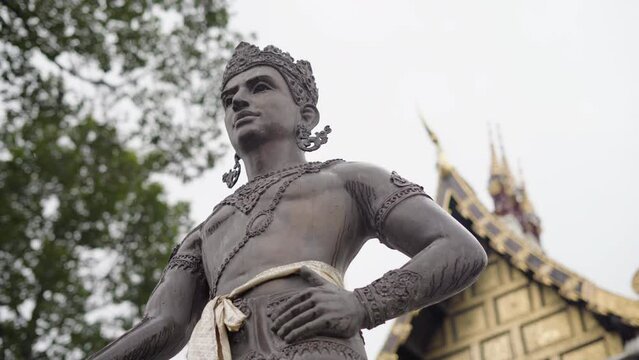 statue outside the Wat Chedi Luang Worawihan temple in Chiang Mai while it rains, chiang mai, thailand