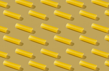 Pattern of cannelloni noodle on yellow background