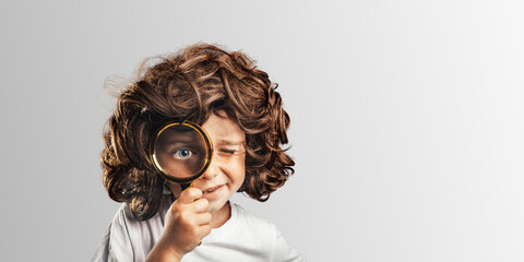 Child see through magnifying glass on the png backgrounds.