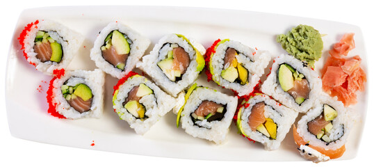 Appetizing sushi roll uramaki - tobiko roll with salmon, avocado, pepino, tobiko. Isolated over white background