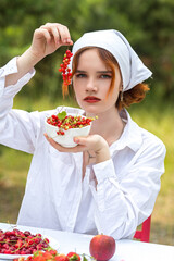 woman eating strawberry