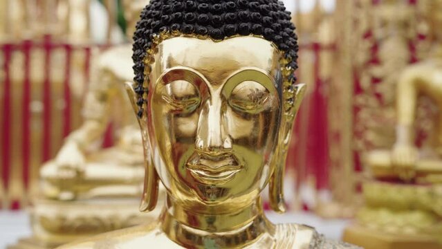 closeup of golden buddha at wat phra that doi suthep temple in chiang mai, thailand