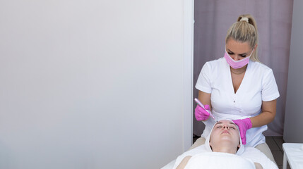 Banner Cosmetologist Making Mesotherapy Injection With Dermapen On Face Of Beautiful Young Woman...