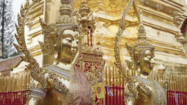 two buddhas of wat phra that doi suthep temple in chiang mai, thailand