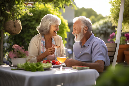 affectionate elderly couple marking anniversary with restaurant celebration