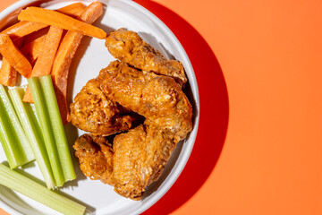 Chicken Wing Dinner Plate with Side of Carrots and Celery