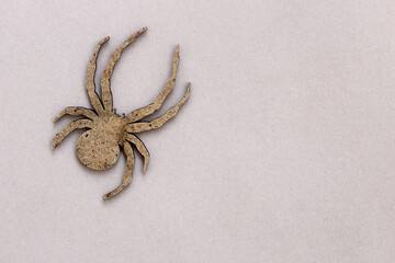 Wooden spider toy on a gray background, Halloween concept