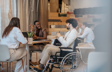 Image of three young business people having meetings in the coffee shop