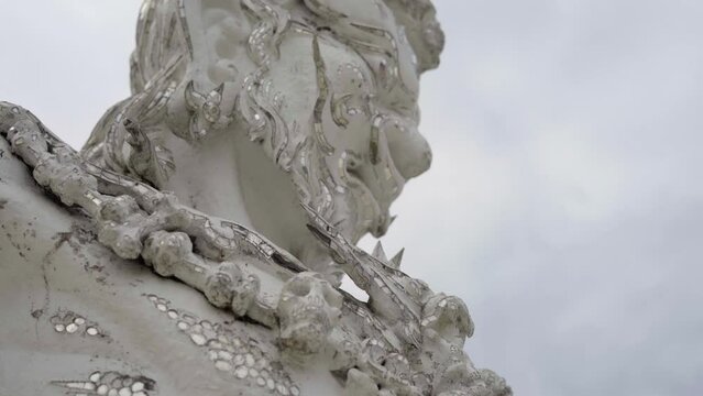 head of a statue of a warrior from the Wat Rong Khun - White Temple in chiang rai, thailand