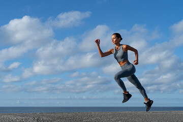 Obraz na płótnie Canvas athletic brunette girl doing fitness doing exercises leading a healthy lifestyle