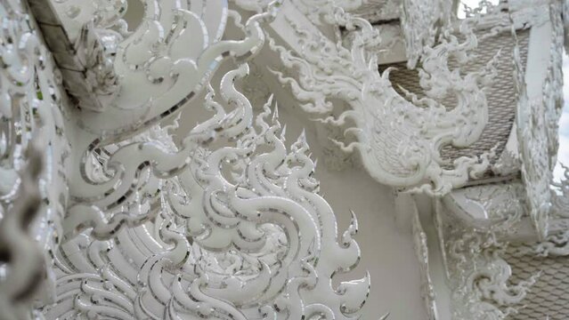 details of the exteriors of the Wat Rong Khun - White Temple in chiang rai, thailand