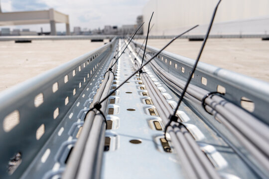 Cable tray for laying and protecting cables and wires